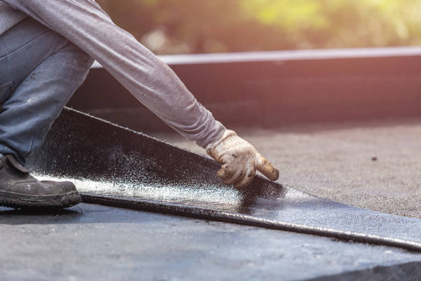 Professional Basement Waterproofing technician working in Clinton, IL